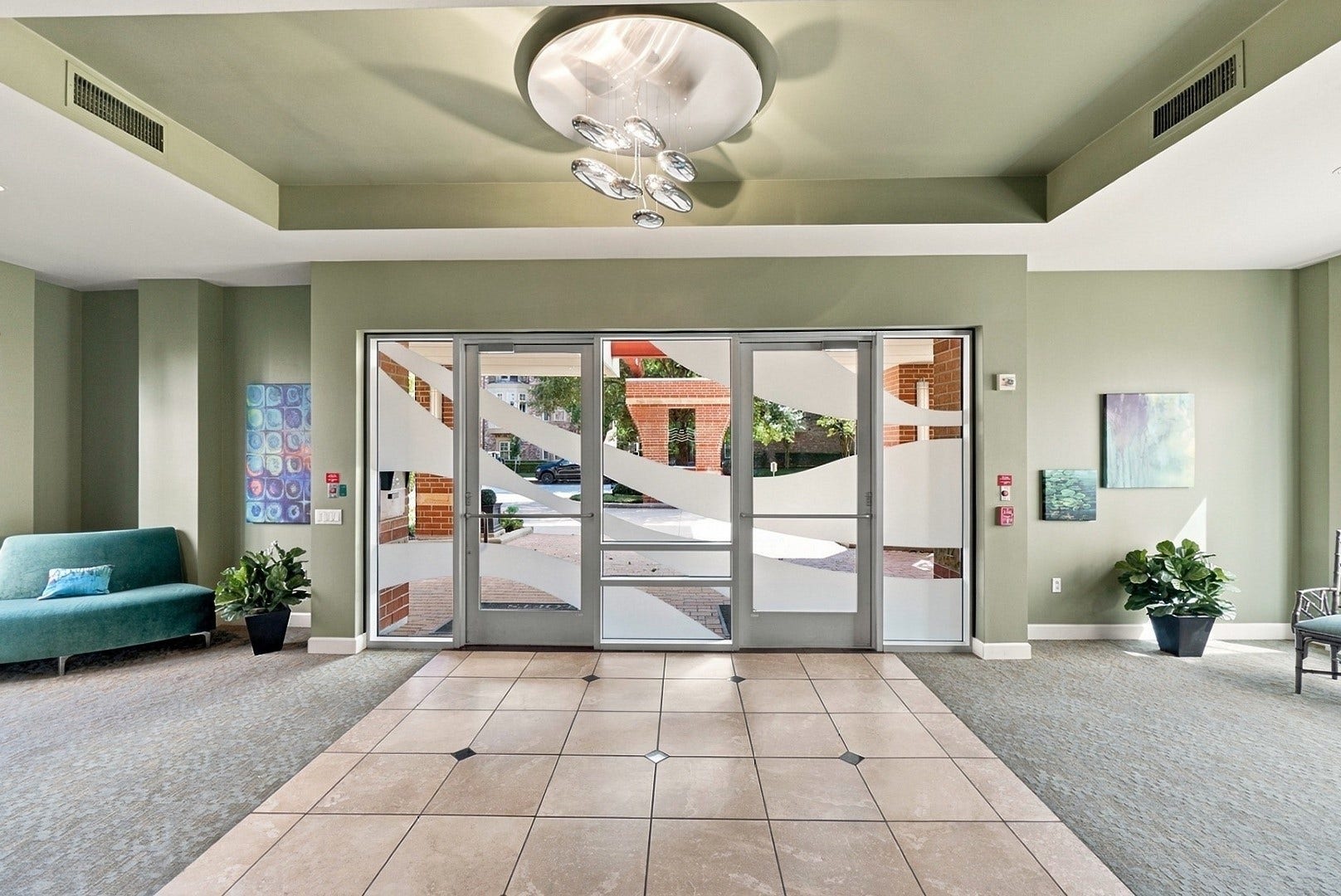 3 Waterway Court, #2D, The Woodlands, TX 77380 Impressive lobby featuring a decorative ceiling, expansive windows, and comfortable seating areas.