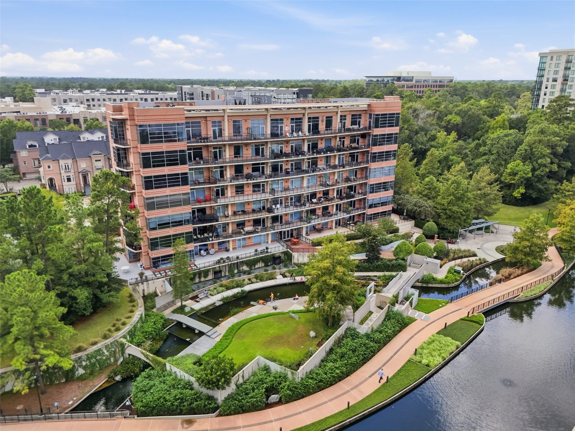 3 Waterway Court, #2D, The Woodlands, TX 77380 Luxury condominium living surrounded by lush landscaping and the scenic Woodlands Waterway.