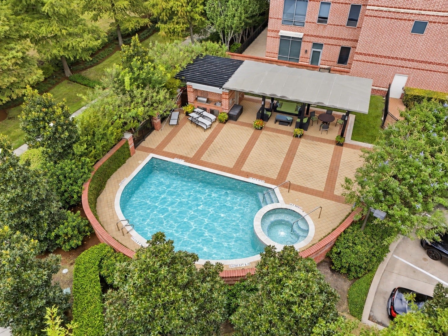 3 Waterway Court, #2D, The Woodlands, TX 77380 Virtually enhanced to show pool once completed. Enjoy resort-inspired relaxation at the community pool, complete with lounge areas and inviting outdoor spaces.