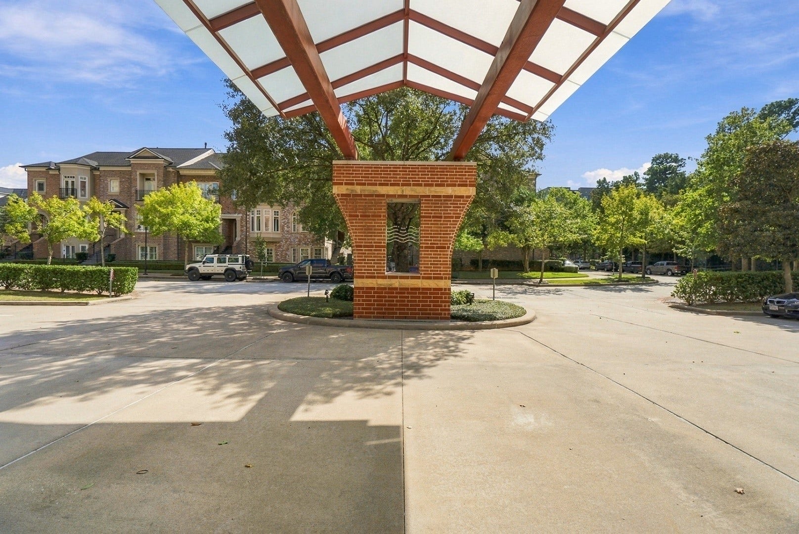 3 Waterway Court, #2D, The Woodlands, TX 77380 Distinctive covered entrance with impressive architectural details and a convenient arrival area.