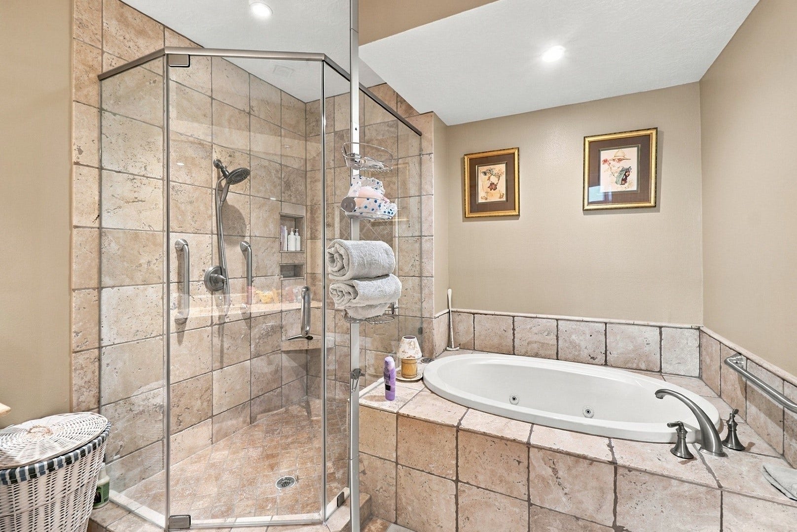3 Waterway Court, #2D, The Woodlands, TX 77380 Relax in the soaking tub or enjoy the separate glass-enclosed shower in this beautifully tiled bathroom.