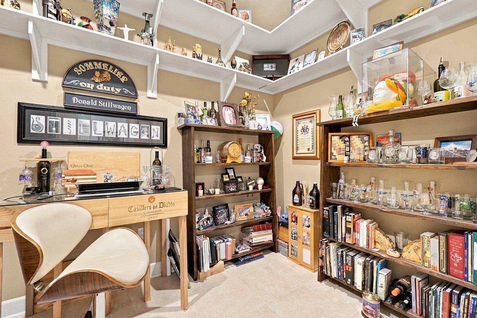 3 Waterway Court, #2D, The Woodlands, TX 77380 A distinctive library and home office featuring custom built-ins, abundant shelving, and timeless character.