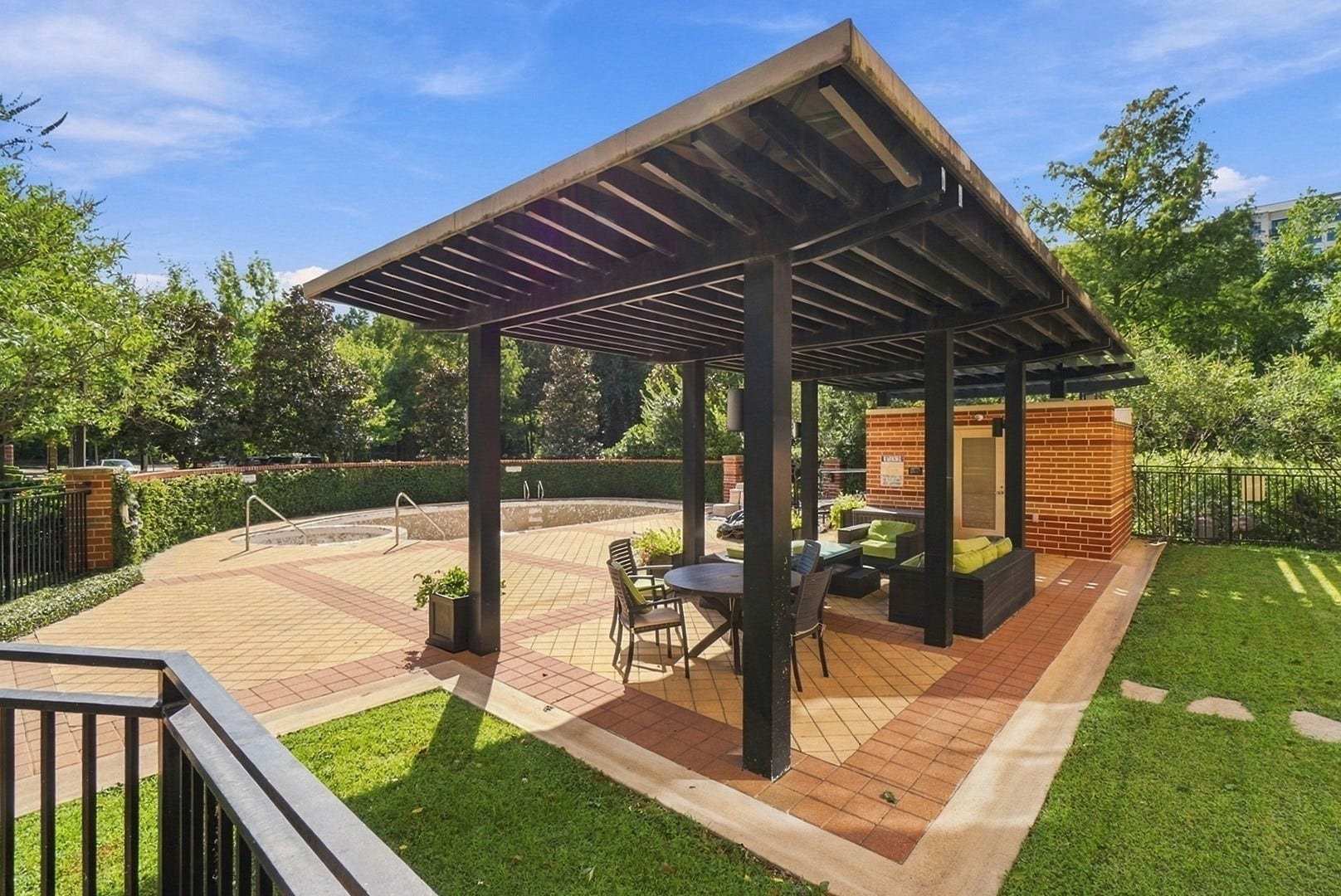 3 Waterway Court, #2D, The Woodlands, TX 77380 Covered outdoor gathering area offering a relaxing setting surrounded by lush greenery.
