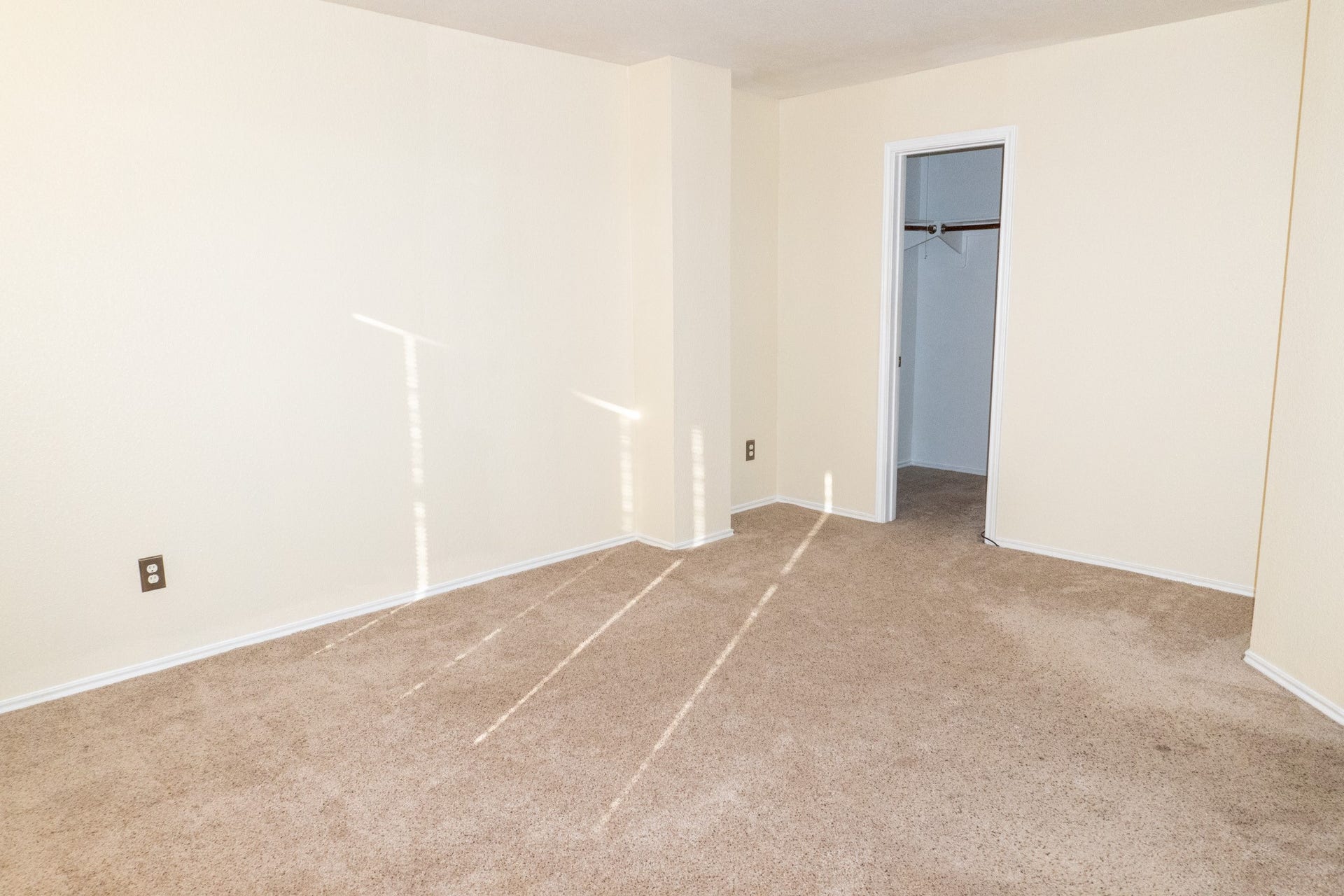 7627 Greenwood Point Drive, Cypress, TX 77433 Commodious bedroom with soft carpet flooring, neutral walls, and a convenient walk-in closet.