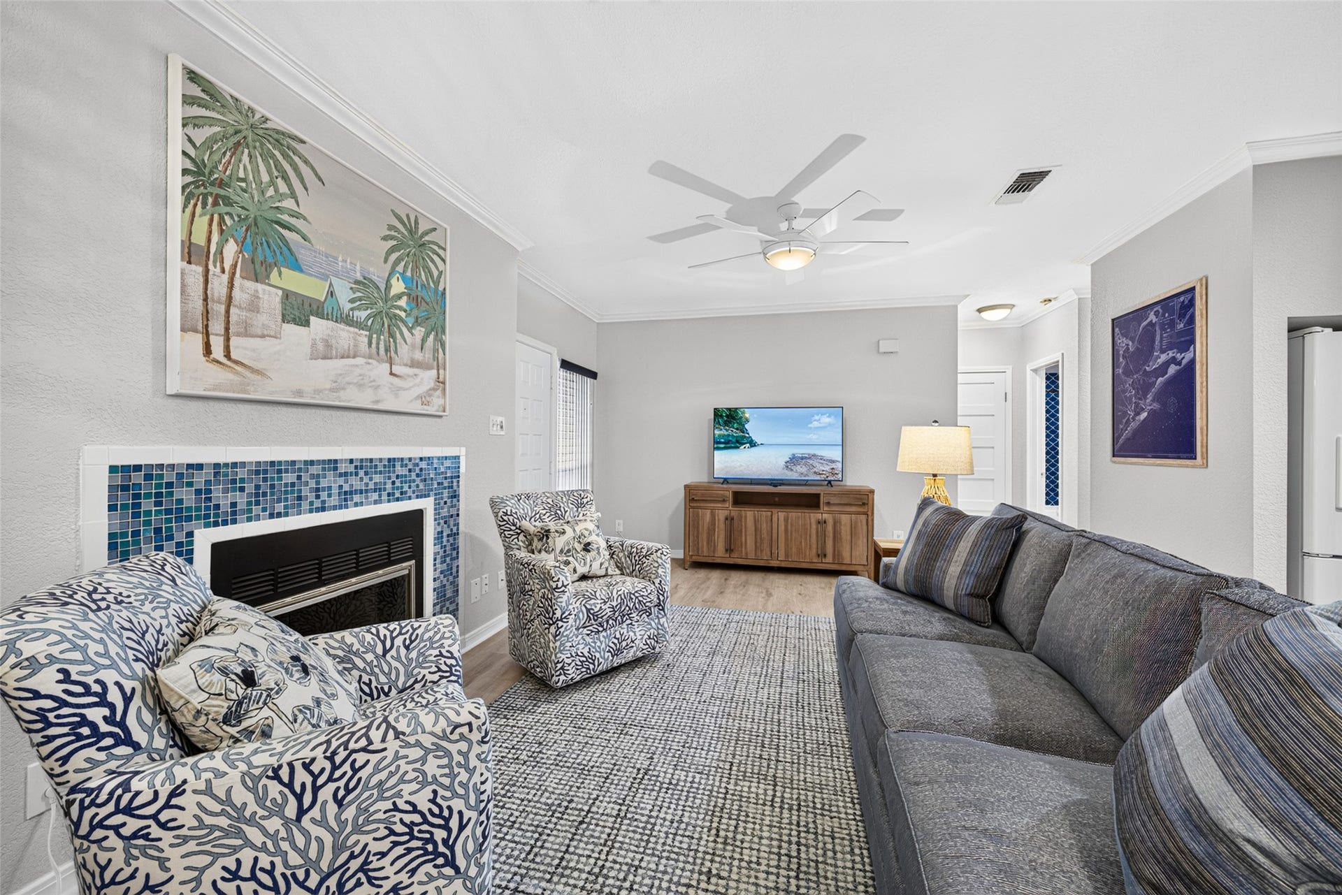 Living room area situated around the wood burning fireplace