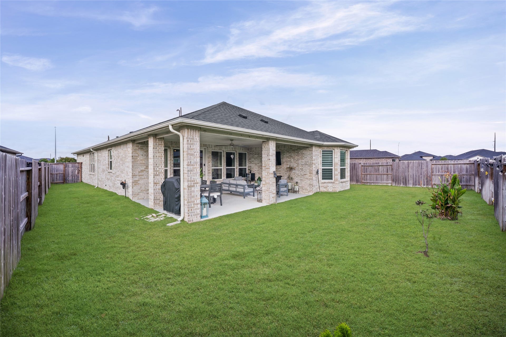 A spacious backyard offers plenty of room to enjoy the outdoors, garden or simply unwind.
