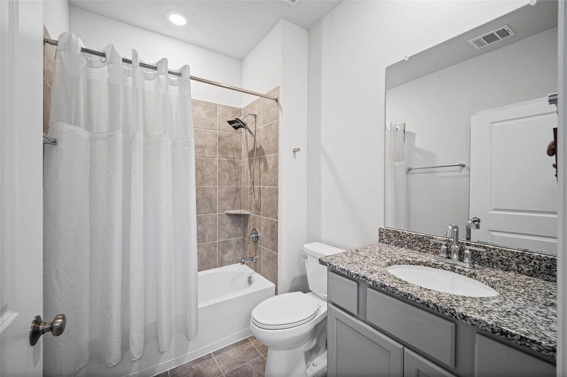 A second full bath offers fresh finishes, practical storage and a comfortable layout.