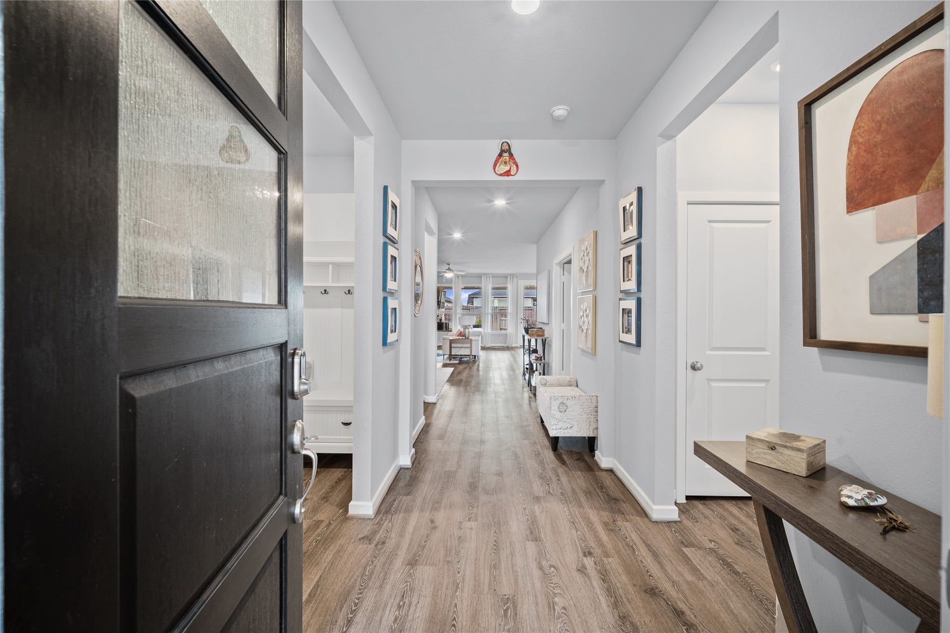 The bright entry sets the tone with clean finishes, natural light and an easy flow into the home.