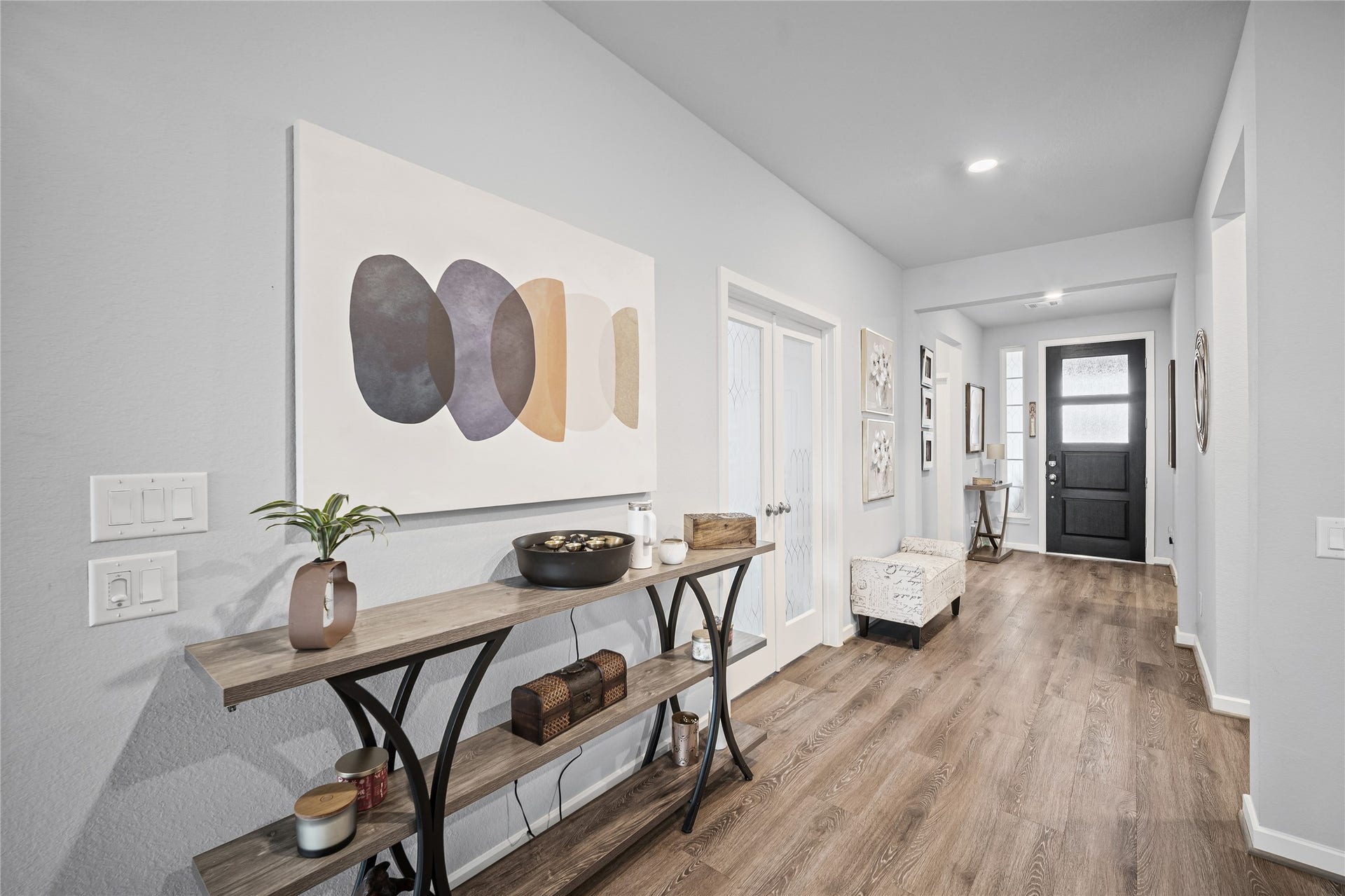 A wide interior hallway highlights the homes thoughtful single-story layout and comfortable connection between living spaces.