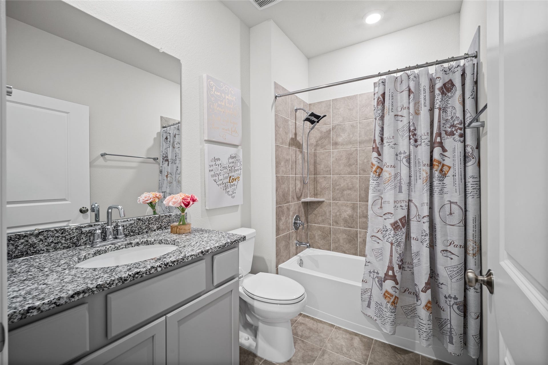 This full bath offers a clean, neutral design with a tub and shower combination for everyday convenience.
