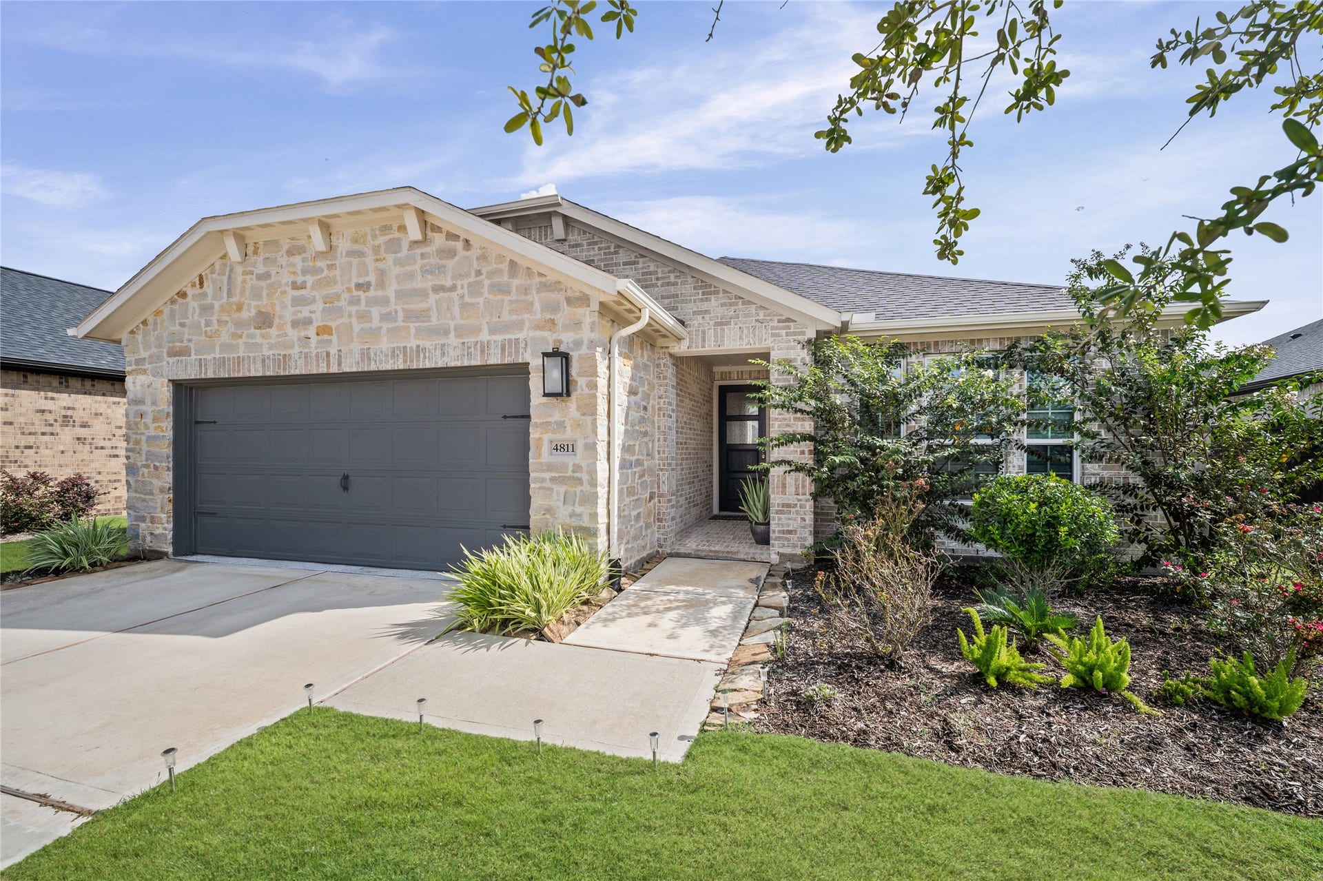 Classic curb appeal, manicured landscaping and a welcoming front elevation create a beautiful first impression.