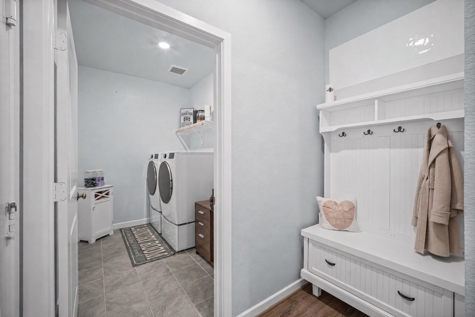 The mud room creates a practical transition from the garage, offering a convenient everyday drop zone and added organization.
