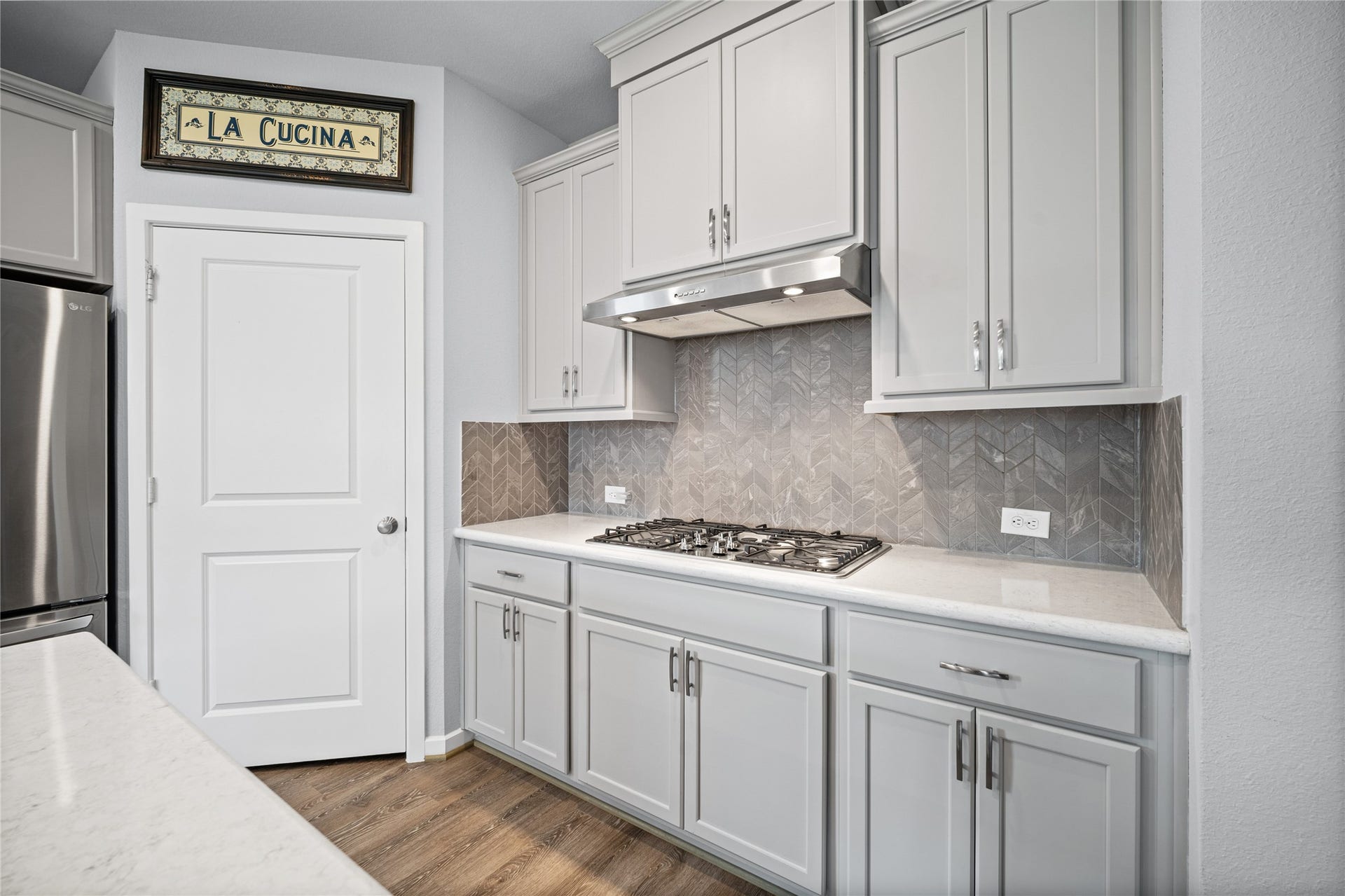 Thoughtful cabinetry and built-in appliances give the kitchen a polished, functional feel.
