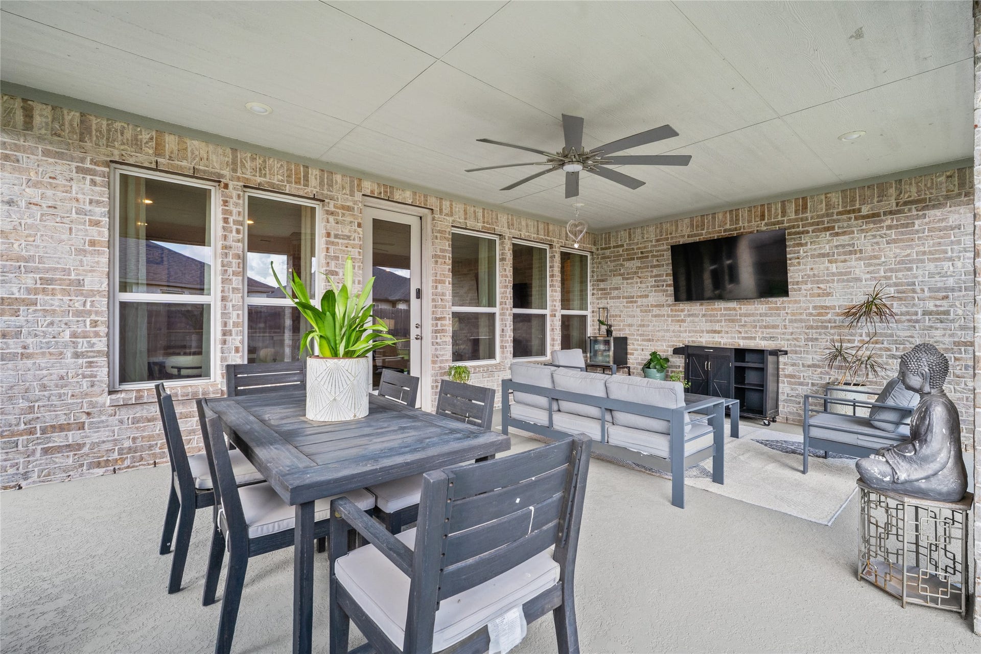 The extended covered patio creates a comfortable outdoor setting for dining, relaxing and entertaining.