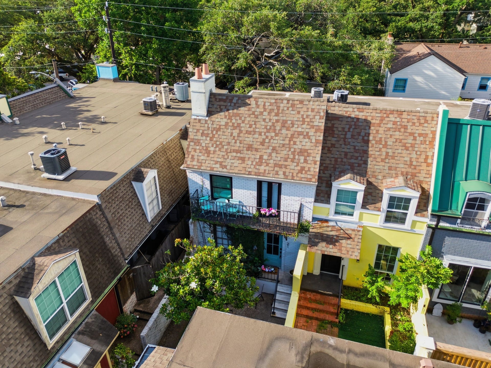 811 Lovett Boulevard, #21, Houston, TX 77006 This view captures the homes two story design, upper balcony, courtyard entry, and distinctive architectural character.