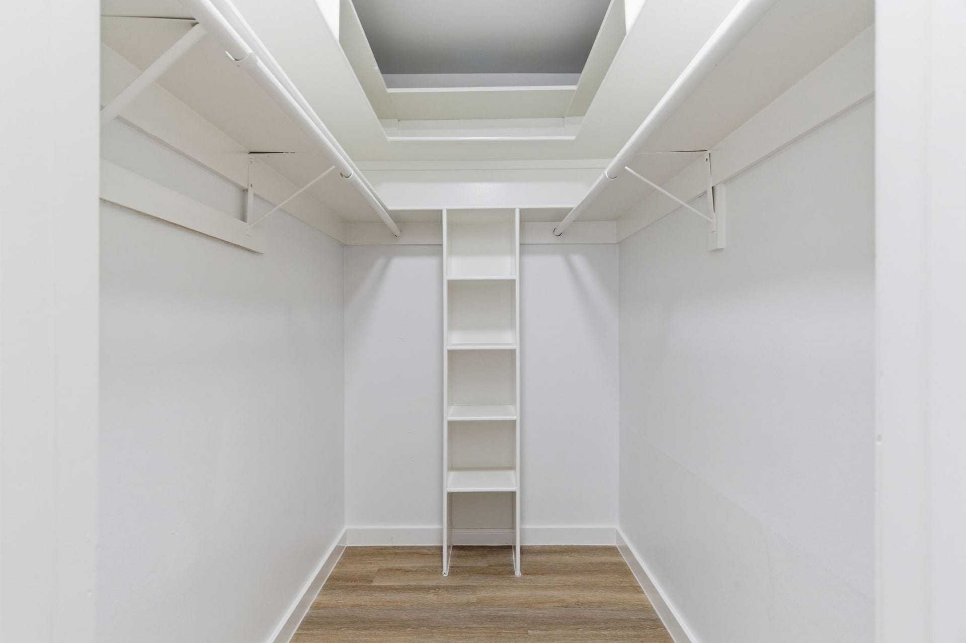 811 Lovett Boulevard, #21, Houston, TX 77006 The walk in closet provides hanging space on both sides along with built in shelving for added organization.