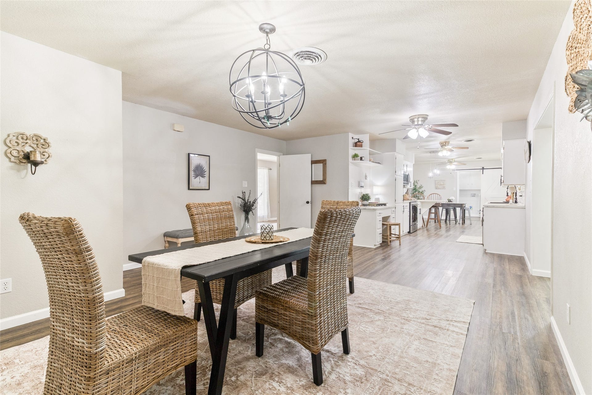 404 S 14th Street, West Columbia, TX 77486 Vinyl plank flooring (2020) carries a consistent wood-look finish through the entire home, helping the interior feel cohesive as you move from room to room.