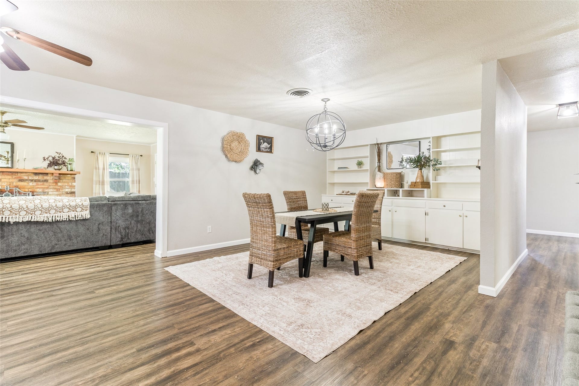 404 S 14th Street, West Columbia, TX 77486 Connected living and dining spaces flow into a private hallway wing, keeping the bedrooms separate from everyday gathering areas.