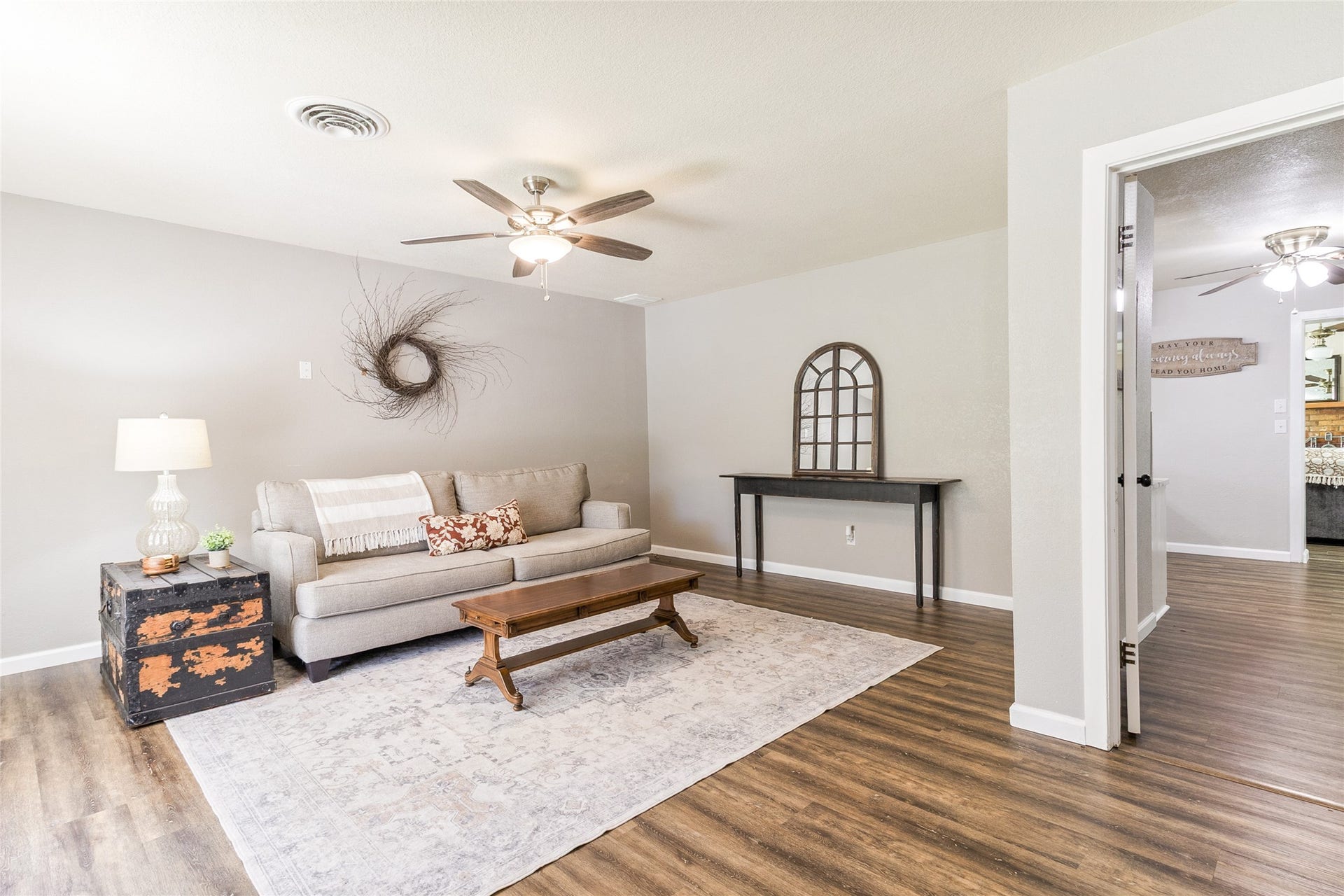 404 S 14th Street, West Columbia, TX 77486 Step through the front door into a light-filled second living area with a wide window overlooking the front yard and views into the additional living spaces.