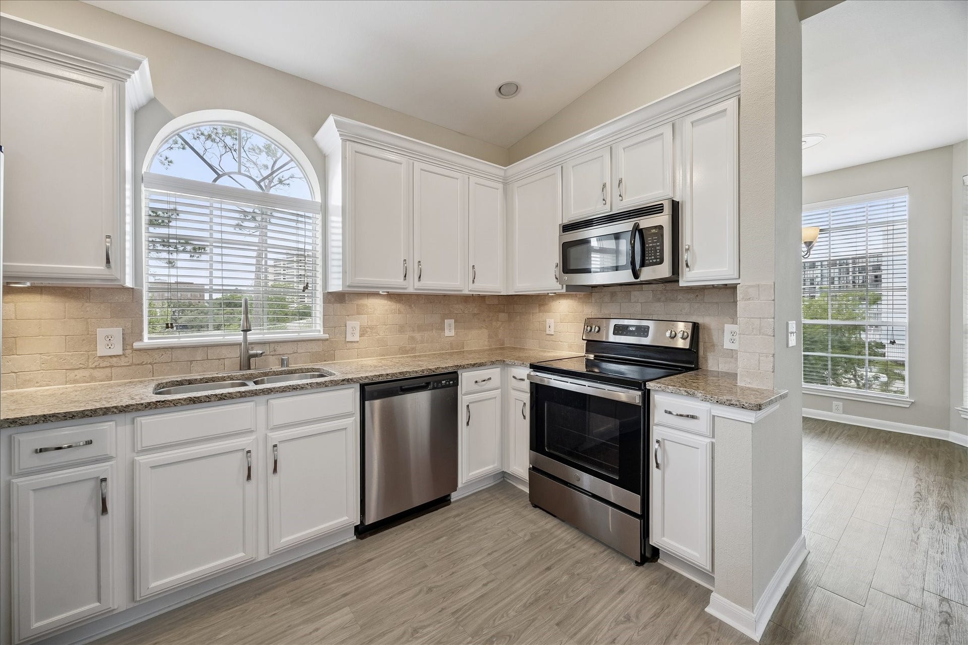 Lots of cabinet space, stainless steel appliances & a wine chiller!