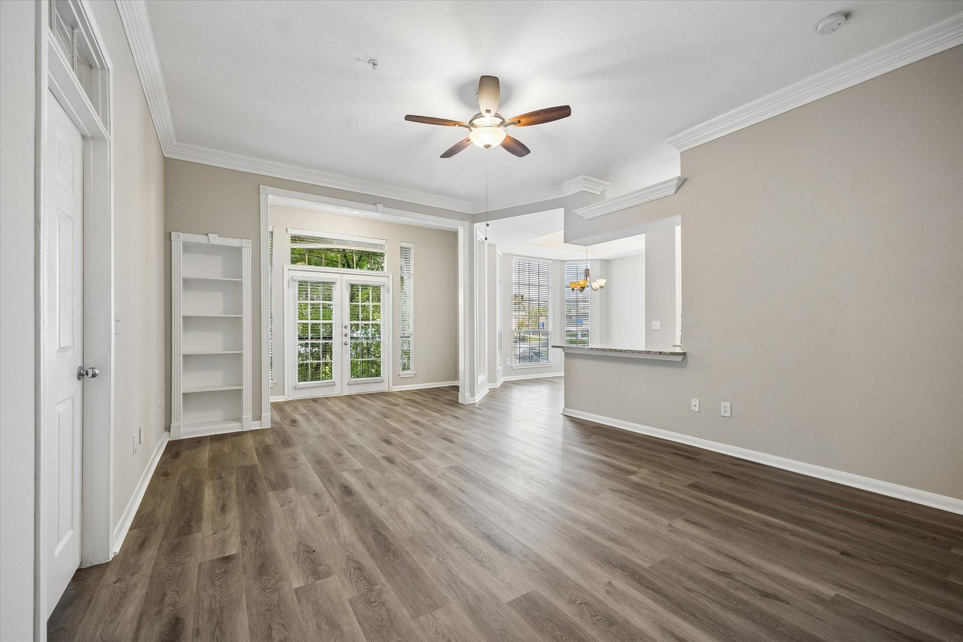 Sunroom with a Juliet balcony and built-in bookcases!