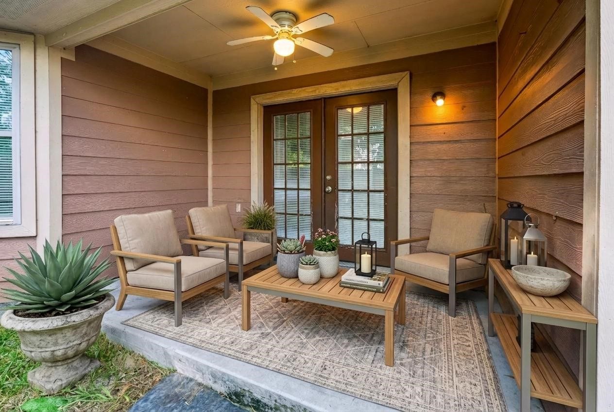 6528 Utah Street, Houston, TX 77091 Charming porch with cozy seating, a ceiling fan, and elegant lighting, perfect for relaxing evenings.