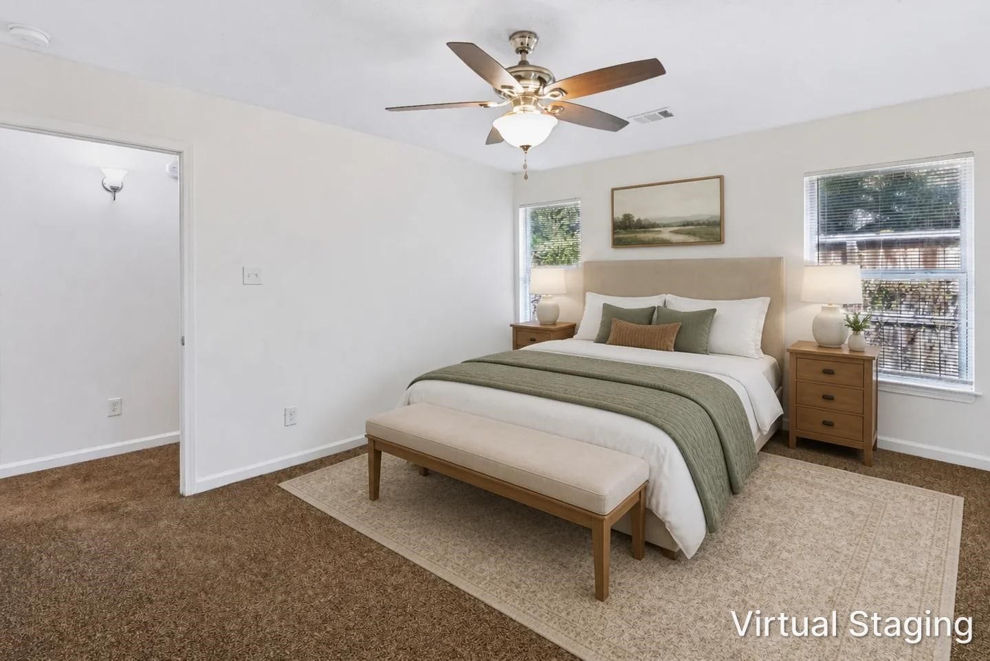 6528 Utah Street, Houston, TX 77091 Spacious bedroom with plush carpeting, featuring a cozy bed with elegant green accents, two large windows for natural light, and a ceiling fan for comfort.