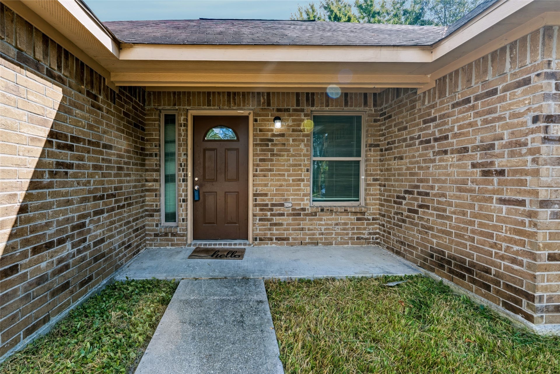 6528 Utah Street, Houston, TX 77091 Charming brick entryway with a welcoming front door and a cozy covered porch, perfect for greeting guests.