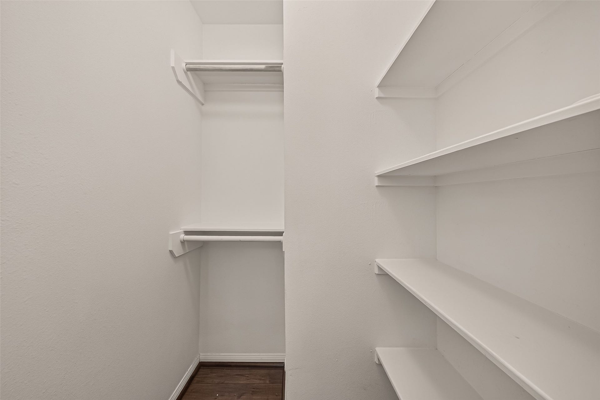 5343 Richmond Avenue, #4, Houston, TX 77056 Spacious walk-in closet featuring ample shelving and hanging space for organized storage.
