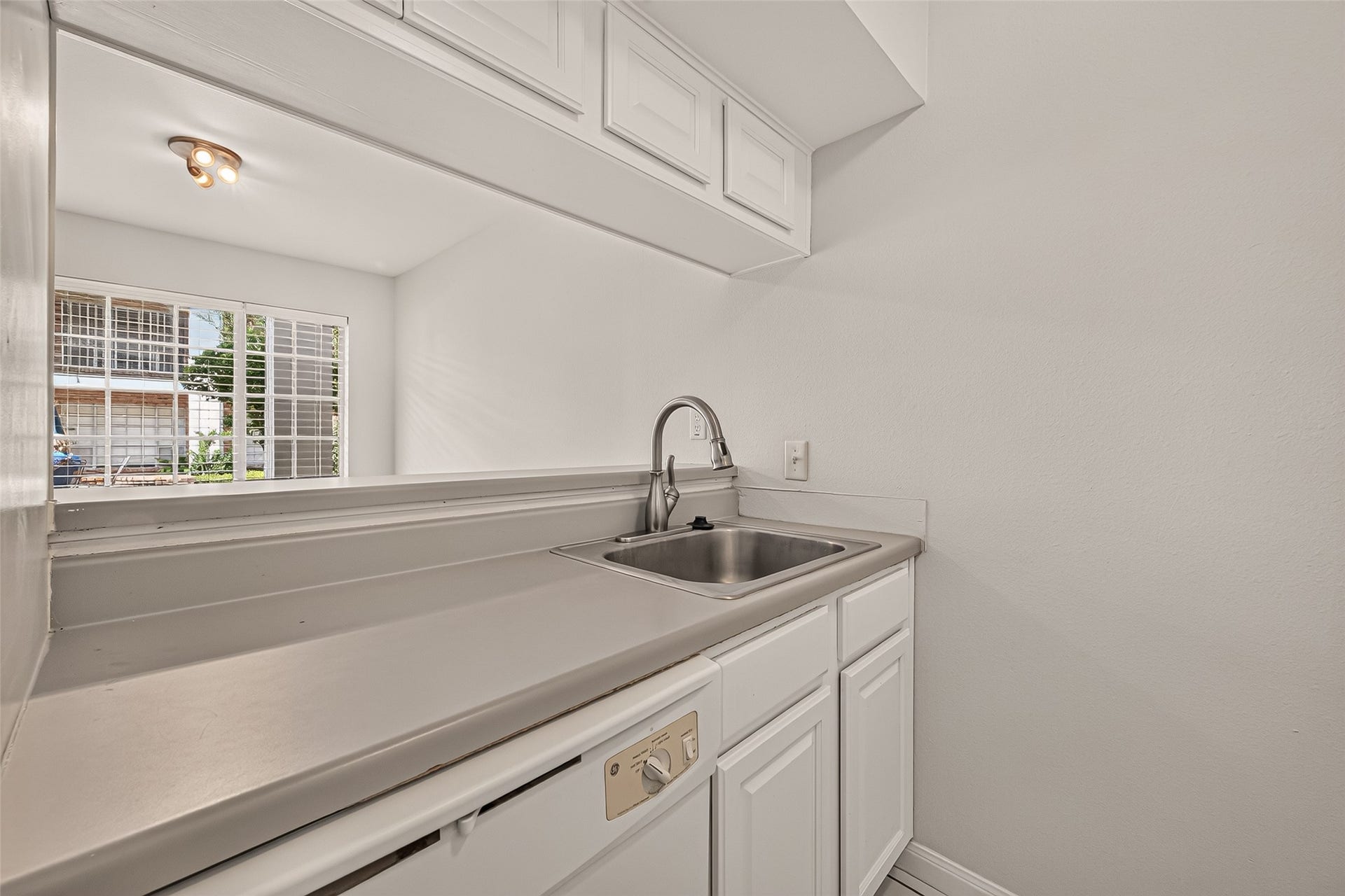 5343 Richmond Avenue, #4, Houston, TX 77056 Compact kitchen area with sleek countertops, a stainless steel sink, and ample cabinetry, offering a clean and functional space.