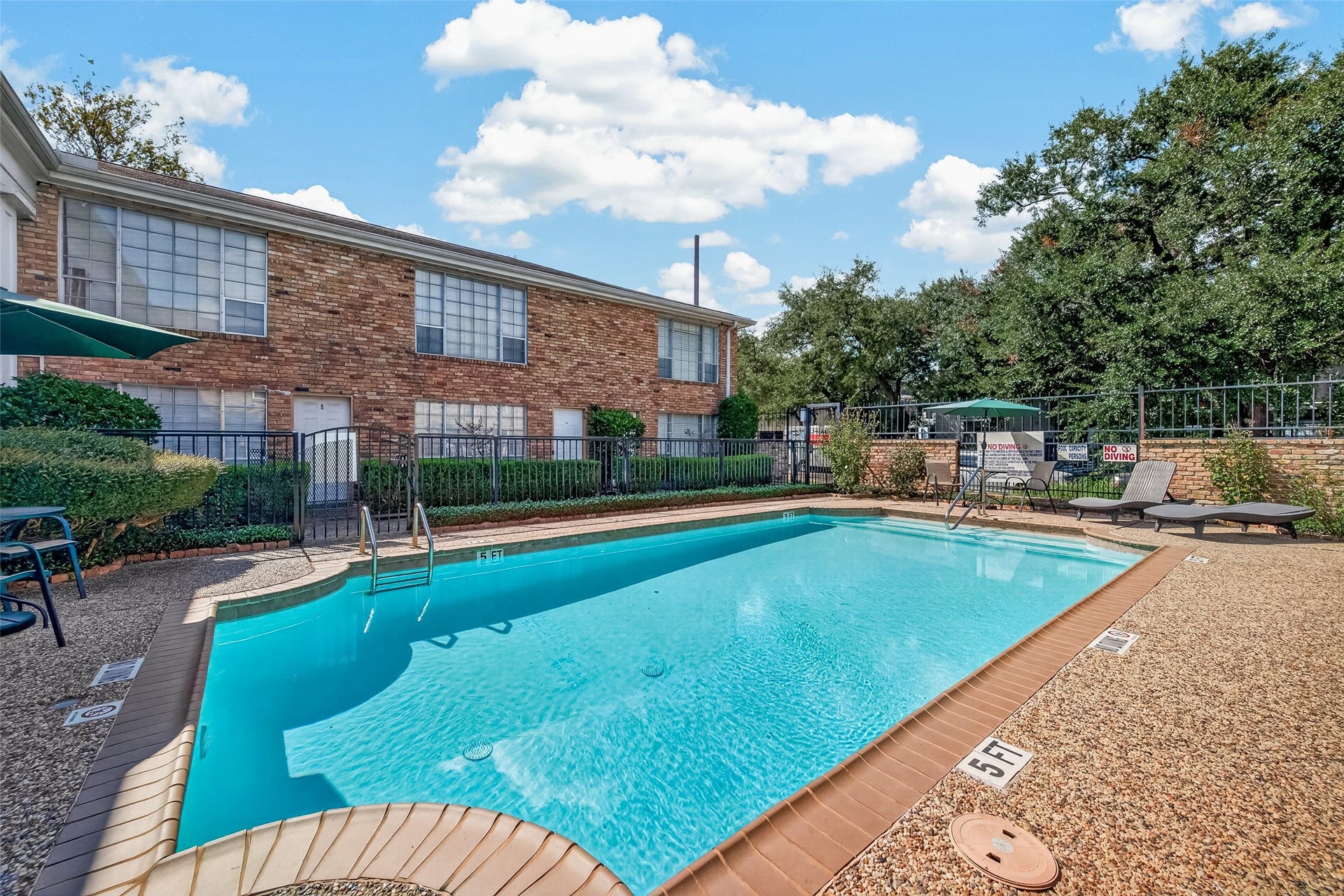 5343 Richmond Avenue, #4, Houston, TX 77056 Enjoy a refreshing dip in the community pool, surrounded by a spacious patio area perfect for lounging and relaxation.