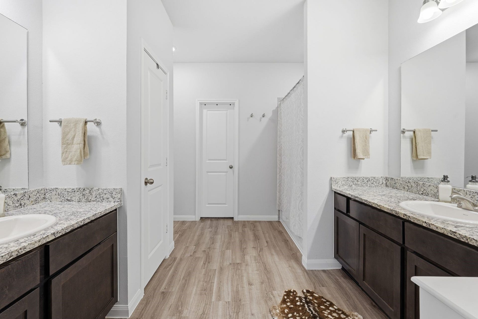 26582 Armadillo Drive, Hempstead, TX 77445 Large primary bathroom with double sinks and a shower and tub