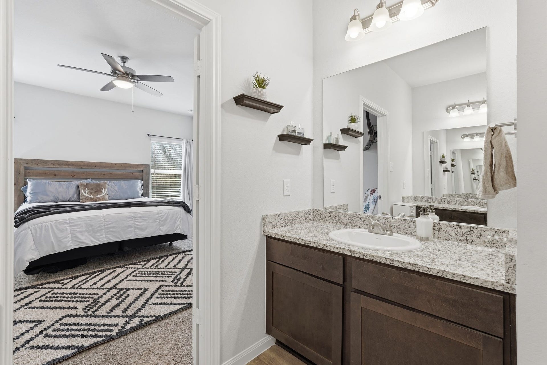 26582 Armadillo Drive, Hempstead, TX 77445 Large primary bathroom with double sinks and a shower and tub