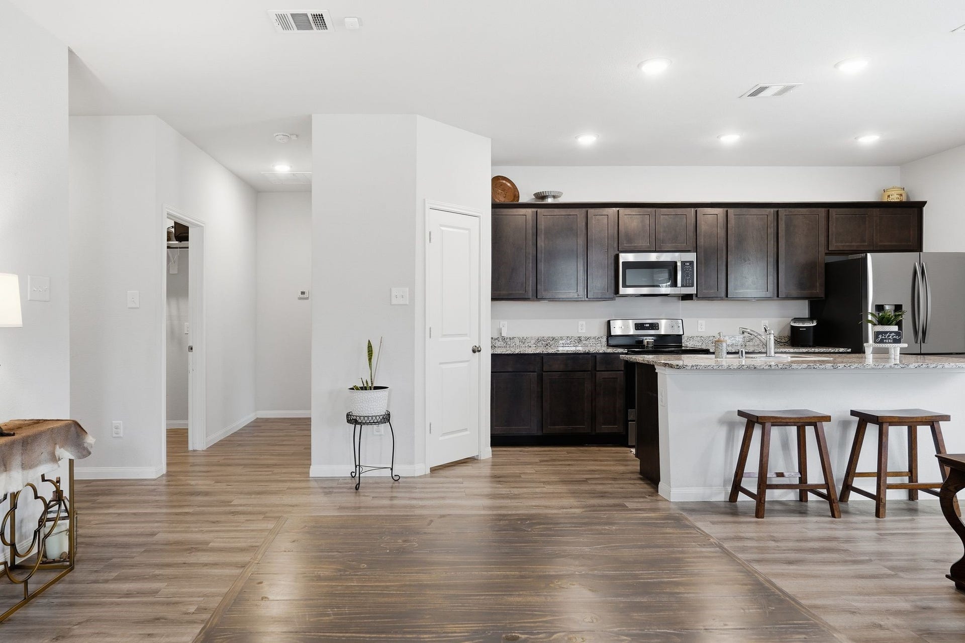 26582 Armadillo Drive, Hempstead, TX 77445 Hall off of the kitchen leads to the utility room and primary bedroom