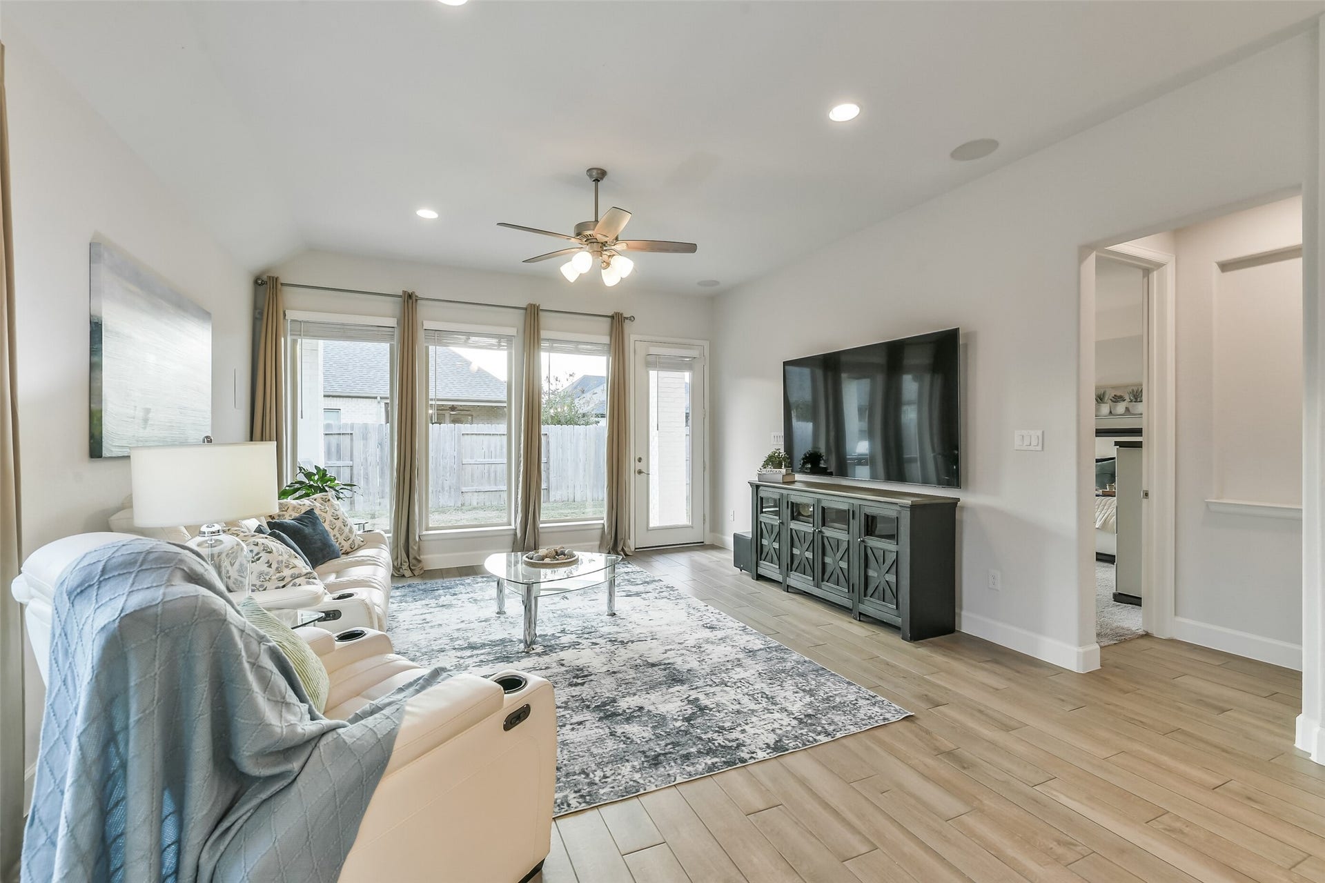 20815 Clydesdale Post Road, Tomball, TX 77377 The living room is perfect for entertaining or enjoying a cozy, quiet evening at home, complete with built-in speakers.
