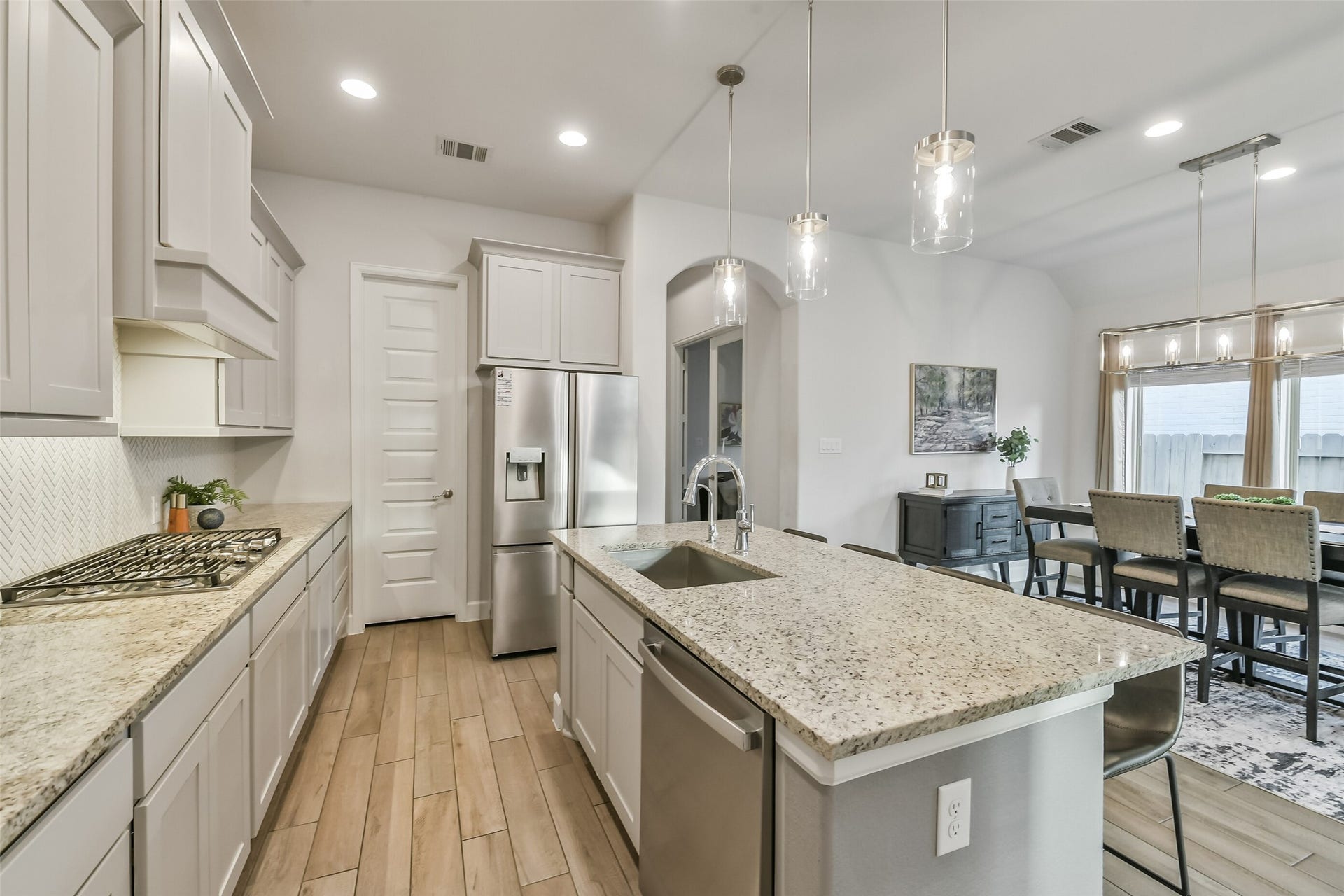 20815 Clydesdale Post Road, Tomball, TX 77377 The kitchen features an oversized walk-in pantry to the left of the refrigerator.