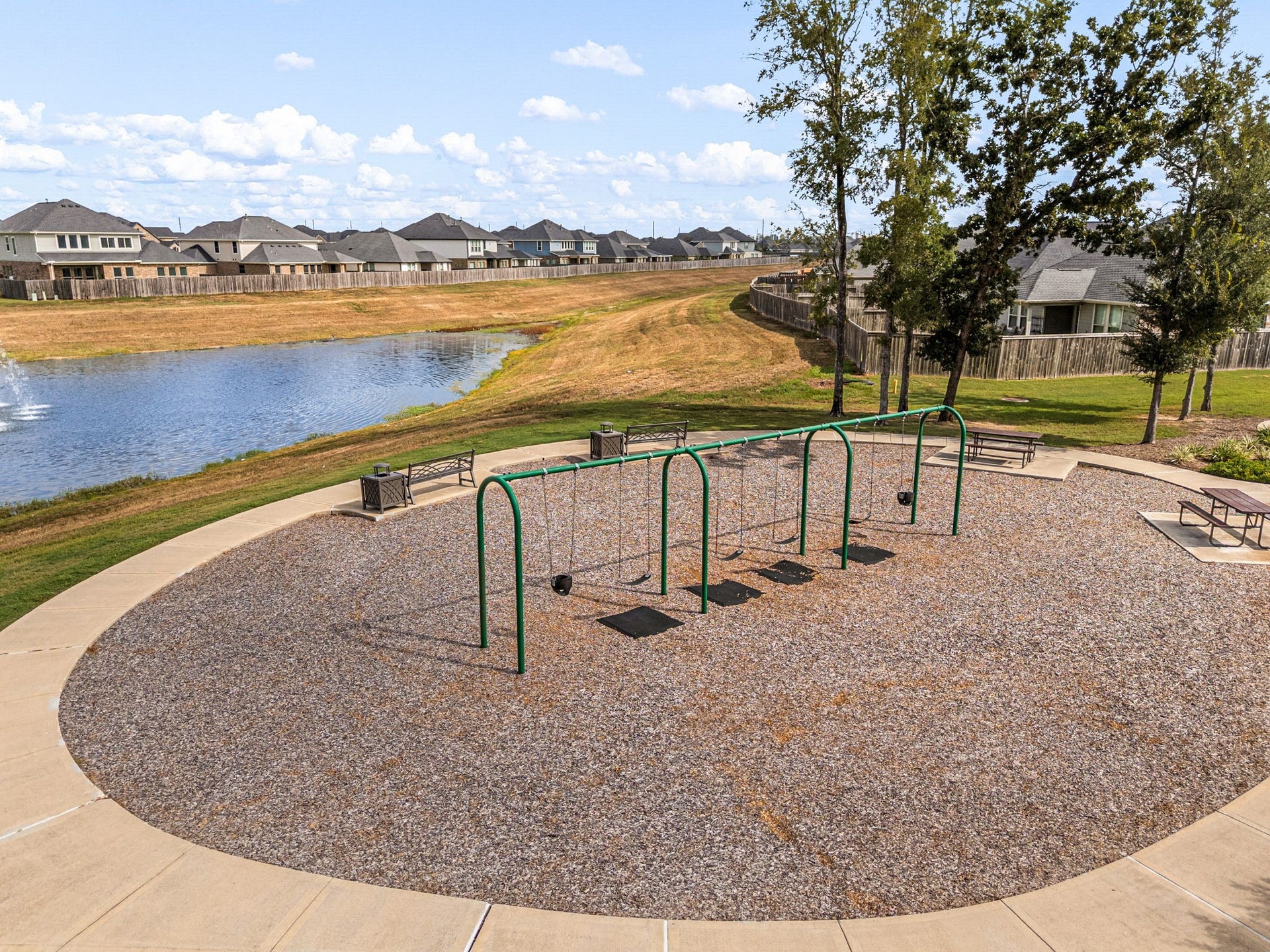 31619 Donoso Drive, Fulshear, TX 77441 Open green spaces and winding paths contribute to Polo Ranchs outdoor-focused setting, with walking trails among the communitys documented amenities.