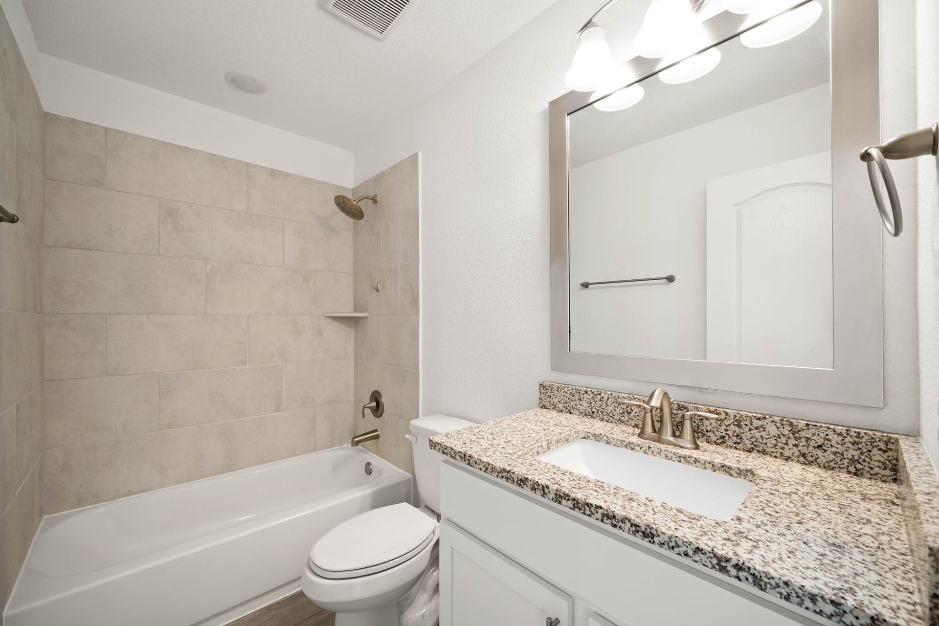 31619 Donoso Drive, Fulshear, TX 77441 This secondary bath includes a granite-topped vanity and a tub/shower combo, convenient for the upstairs bedrooms.