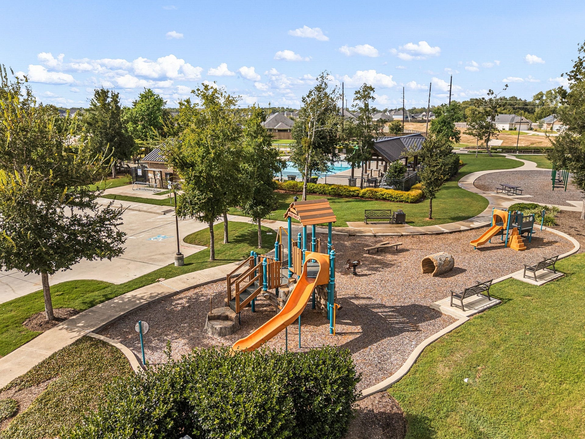 31619 Donoso Drive, Fulshear, TX 77441 Neighborhood playgrounds and parks add to Polo Ranchs outdoor amenities, offering recreation spaces throughout the Fulshear community.