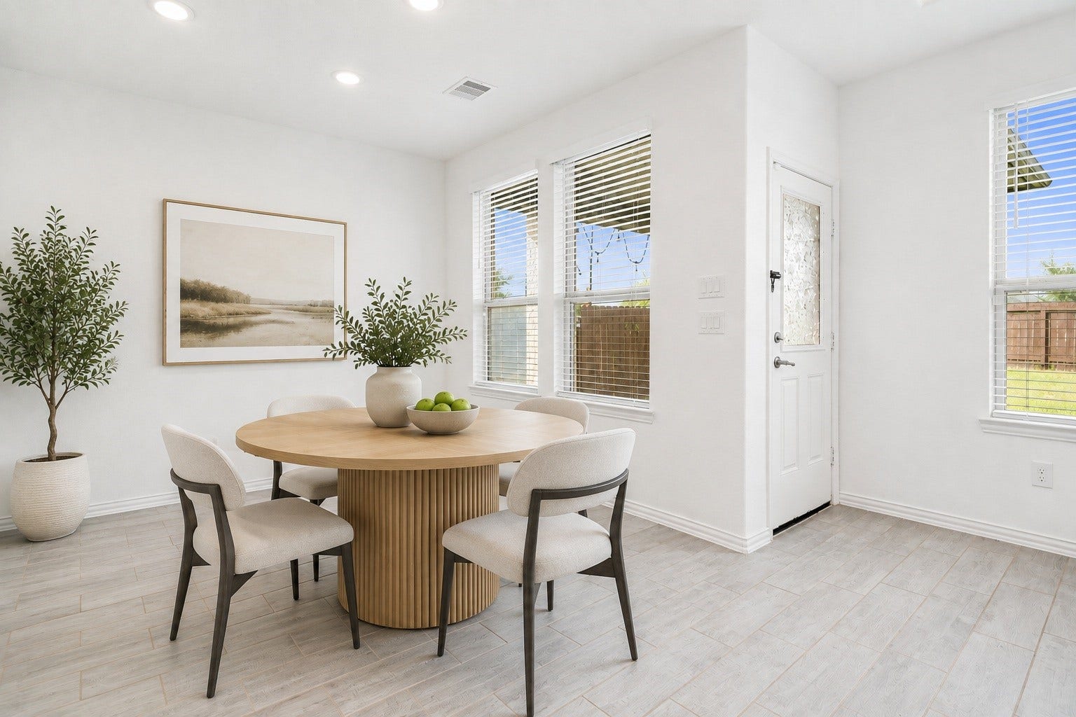 31619 Donoso Drive, Fulshear, TX 77441 The sunlit breakfast nook offers two large windows and direct access to the backyard a bright spot for casual dining. Virtually staged.