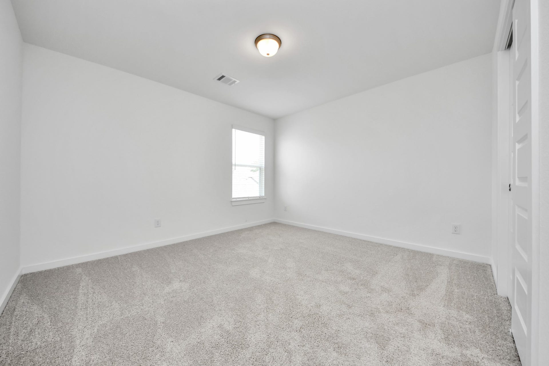 1021 Golden Glow Path, Magnolia, TX 77355 Generously sized secondary bedrooms featuring spacious closets, soft and inviting carpeting underfoot, large windows allowing plenty of natural light, and the added touch of privacy blinds for your personal retreat. Sample photo of completed home with similar floor plan. Actual colors and selections may vary.