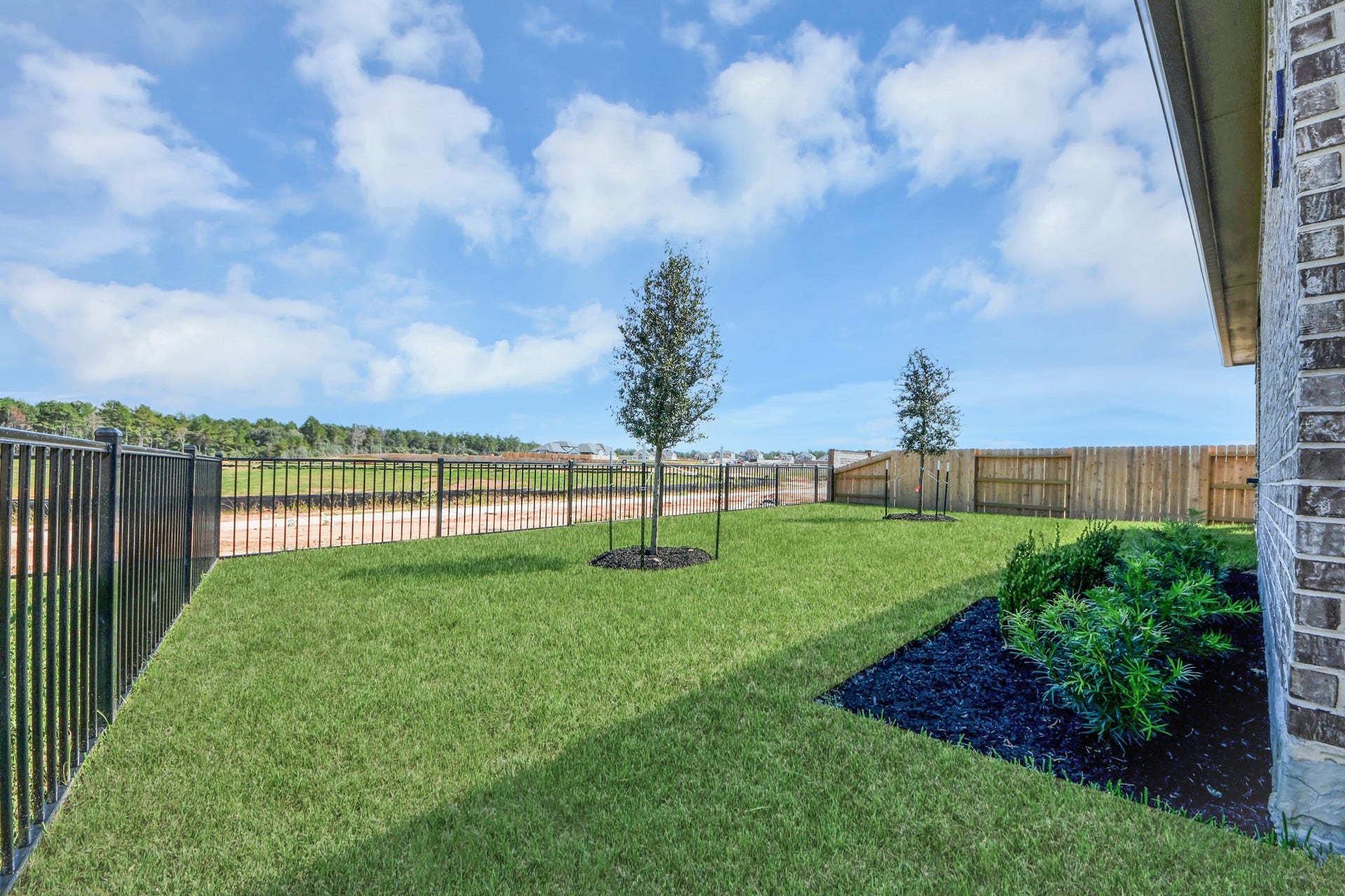 1021 Golden Glow Path, Magnolia, TX 77355 Experience outdoor living at its finest on this expansive covered patio, thoughtfully designed for BBQs and delightful outdoor dining.