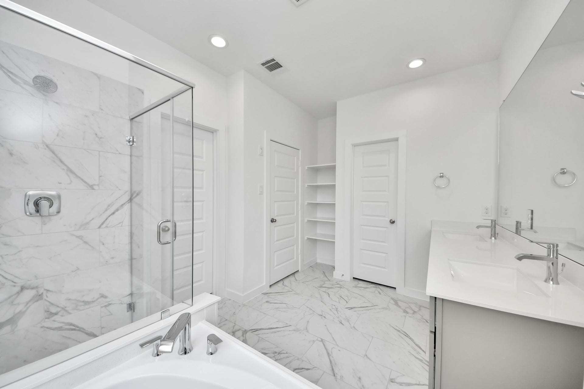 1021 Golden Glow Path, Magnolia, TX 77355 Indulge in a spa-like retreat within the confines of this primary bathroom. Delight in a spacious walk-in shower enveloped in stylish tile surround, unwind in a separate garden tub adorned with custom detailing. Sample photo of completed home with similar floor plan. Actual colors and selections may vary.