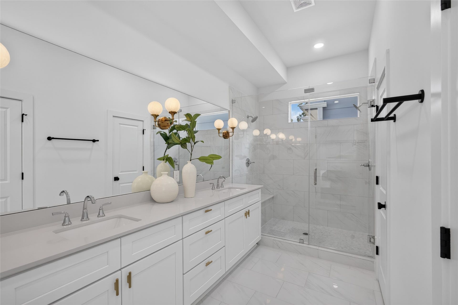 835 Rachel Street, #B, Houston, TX 77091 Elegant primary bathroom featuring dual vanities, quartz countertops, and modern designer finishes.