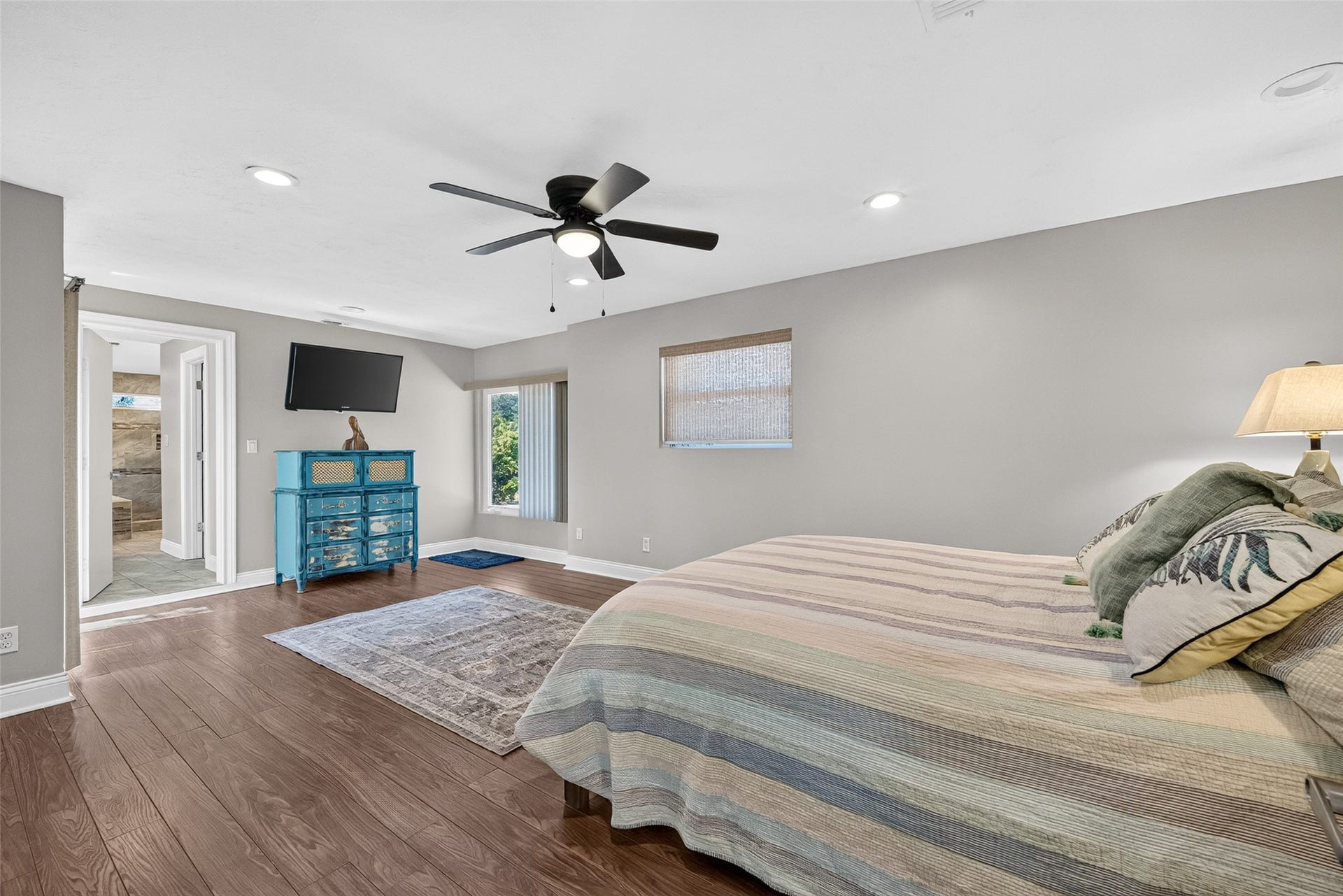 1003 Villa Court Drive, Seabrook, TX 77586 The primary bedroom features a balcony and an en suite bathroom with a walk-in closet.