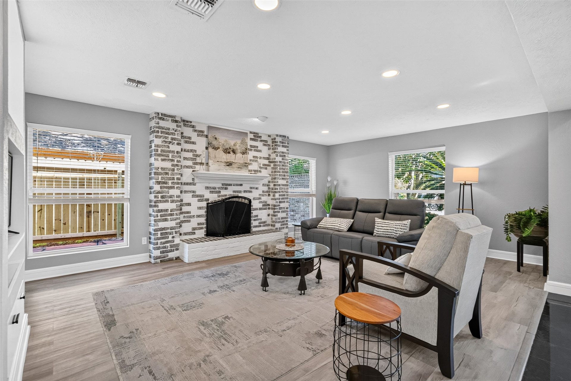 1003 Villa Court Drive, Seabrook, TX 77586 Bright Family Room Anchored by a Charming Wood-Burning Fireplace.