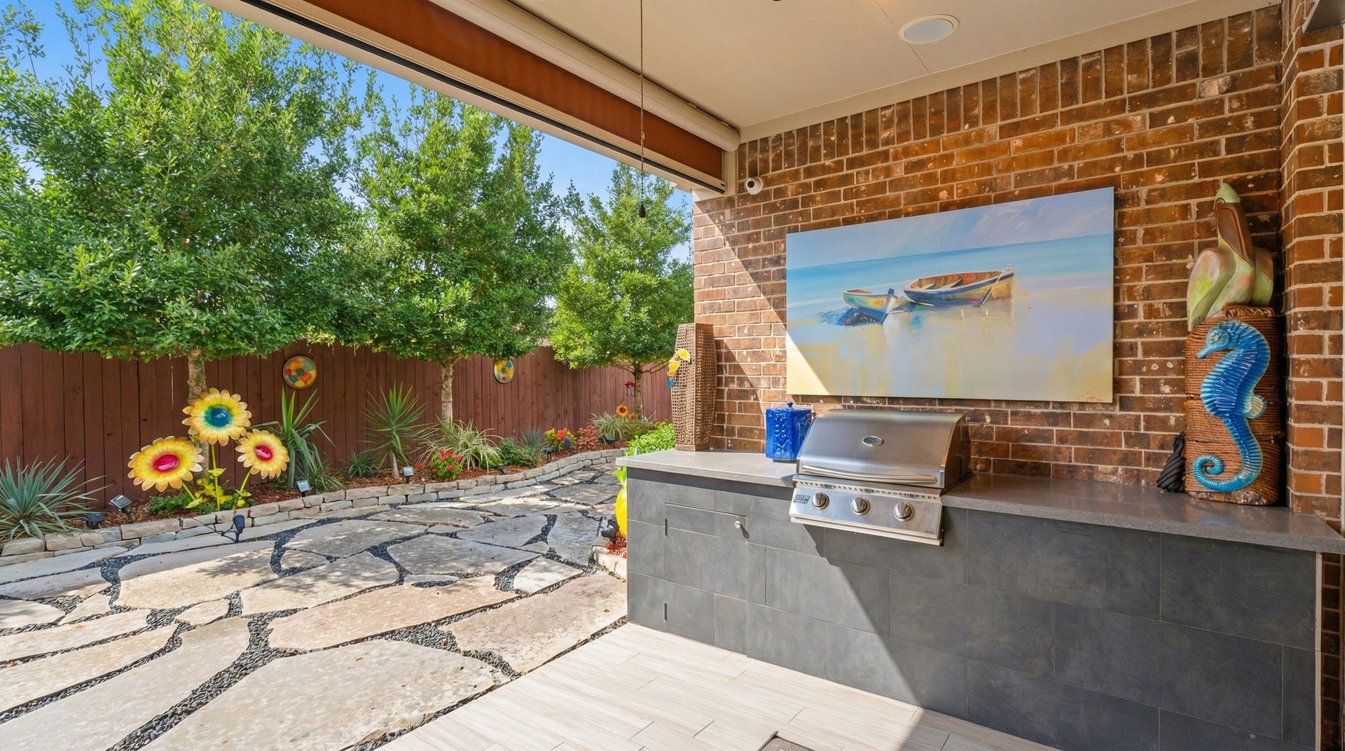 51 Scepter Ridge, Sugar Land, TX 77498 The outdoor kitchen (2022) and patio area highlight the backyard setting. Imagine weekend cookouts, friends visiting, morning coffee and a newspaper and evenings spent enjoying the space. You will feel like you are on vacation without ever leaving your home!