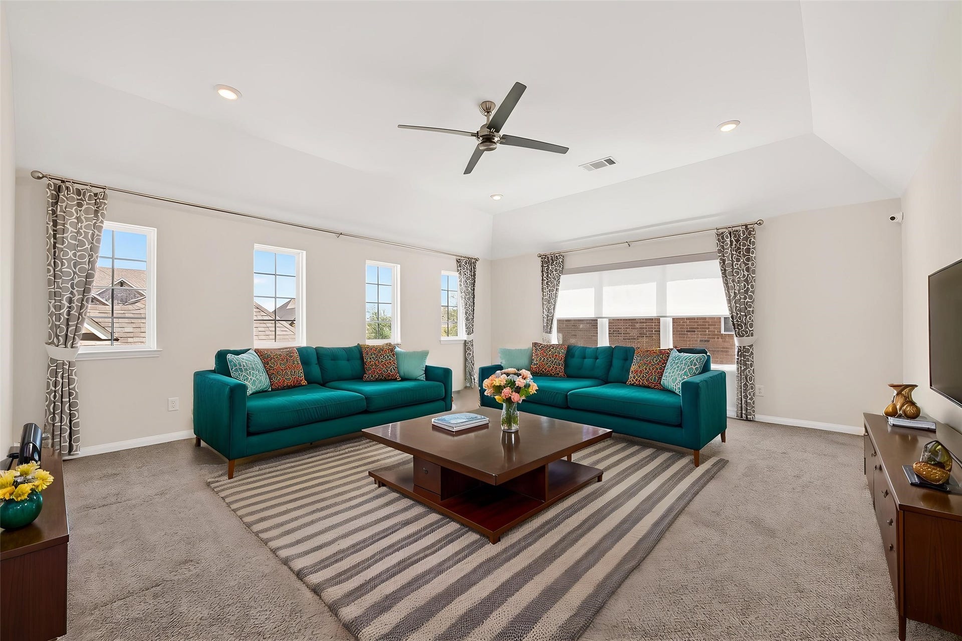 51 Scepter Ridge, Sugar Land, TX 77498 The game room opens wide with plenty of space for seating, games, or entertainment. Imagine lively evenings spent here. This photo is virtually staged to show one possible configuration of furniture. How will YOU make it your own?