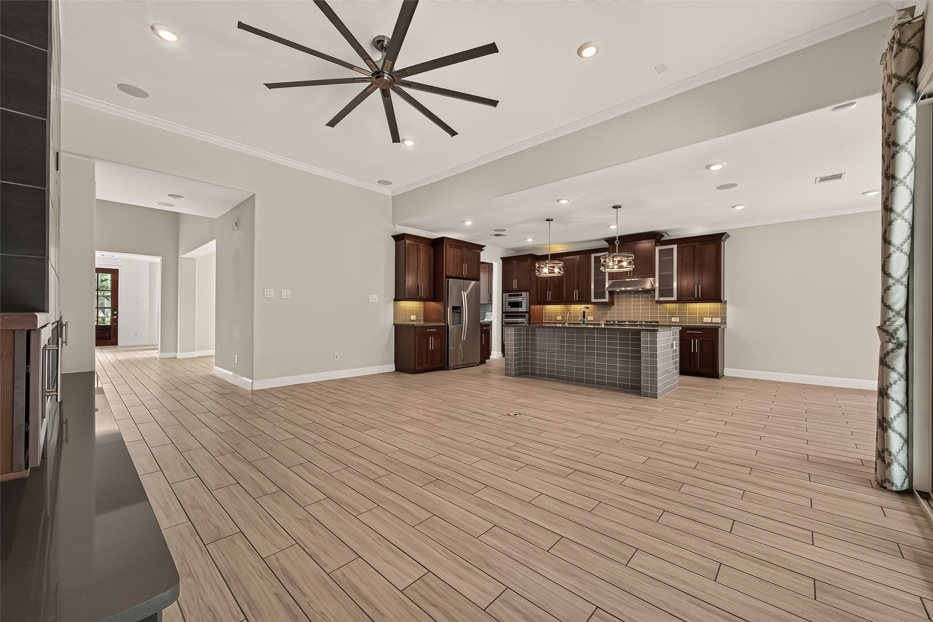 51 Scepter Ridge, Sugar Land, TX 77498 Large windows bring the outdoors in while keeping the room bright throughout the day. Its easy to imagine this becoming your favorite gathering spot.