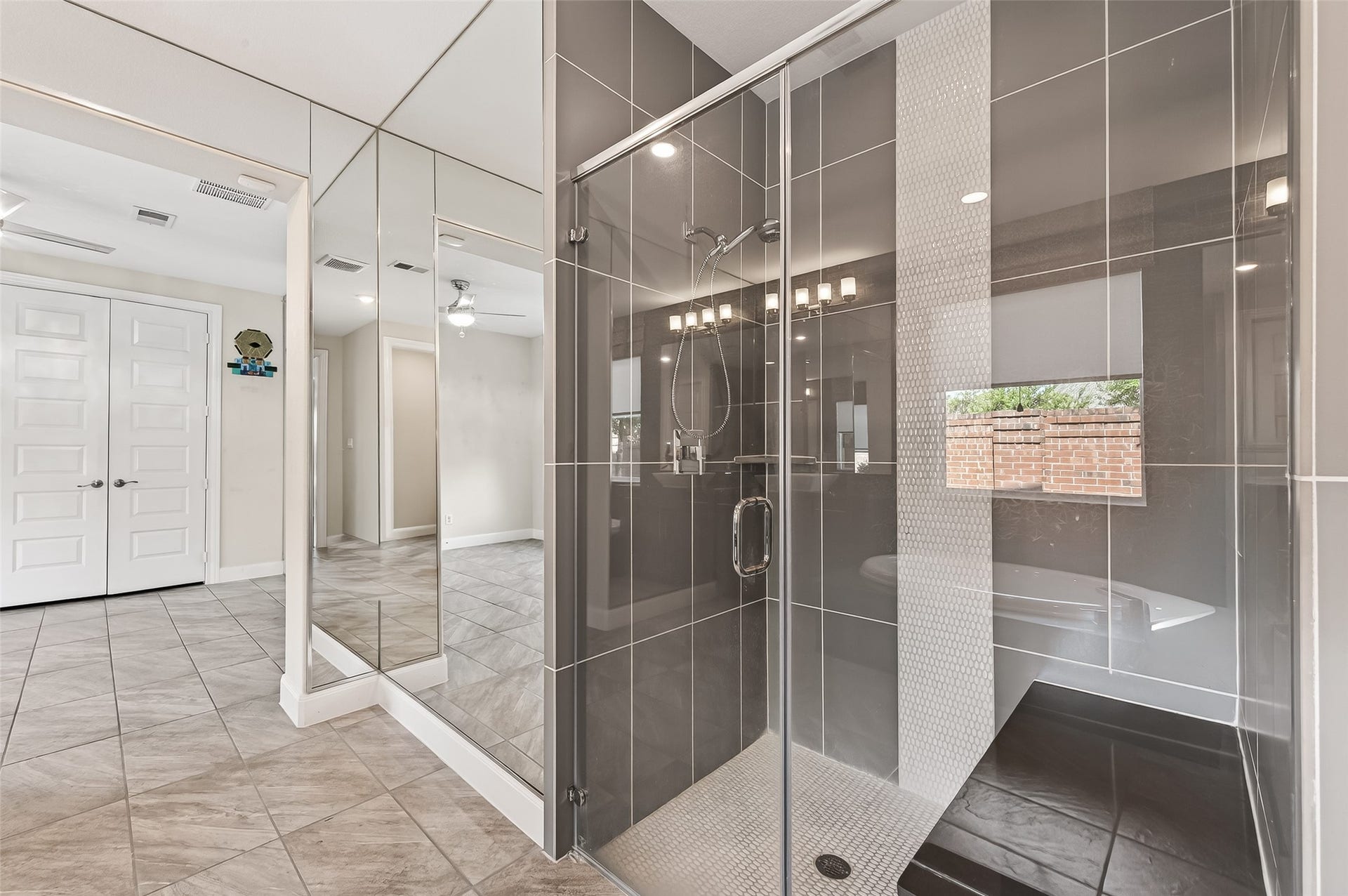 51 Scepter Ridge, Sugar Land, TX 77498 The walk-in shower with frameless glass enclosure adds another stylish, yet practical feature to the Primary Bath, complementing the tub for flexible everyday use.